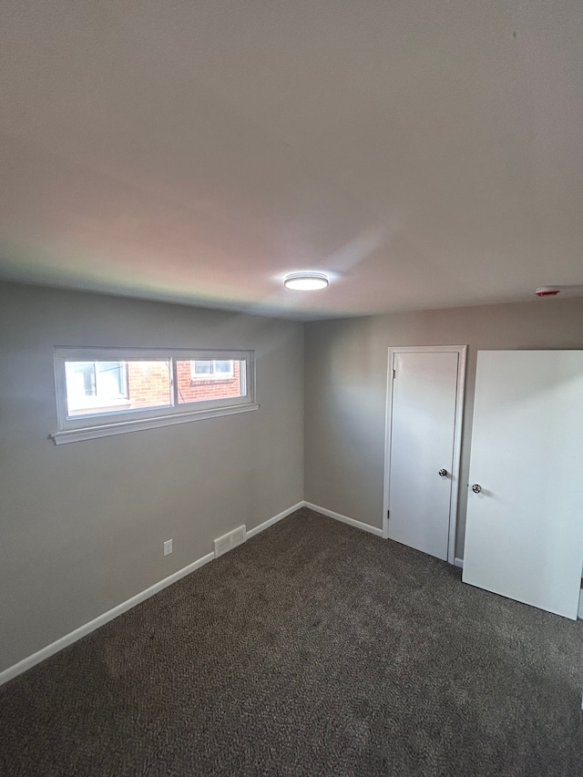 23162 Saxony Ave, Eastpointe, MI 48021 - unfurnished room featuring dark carpet and baseboards