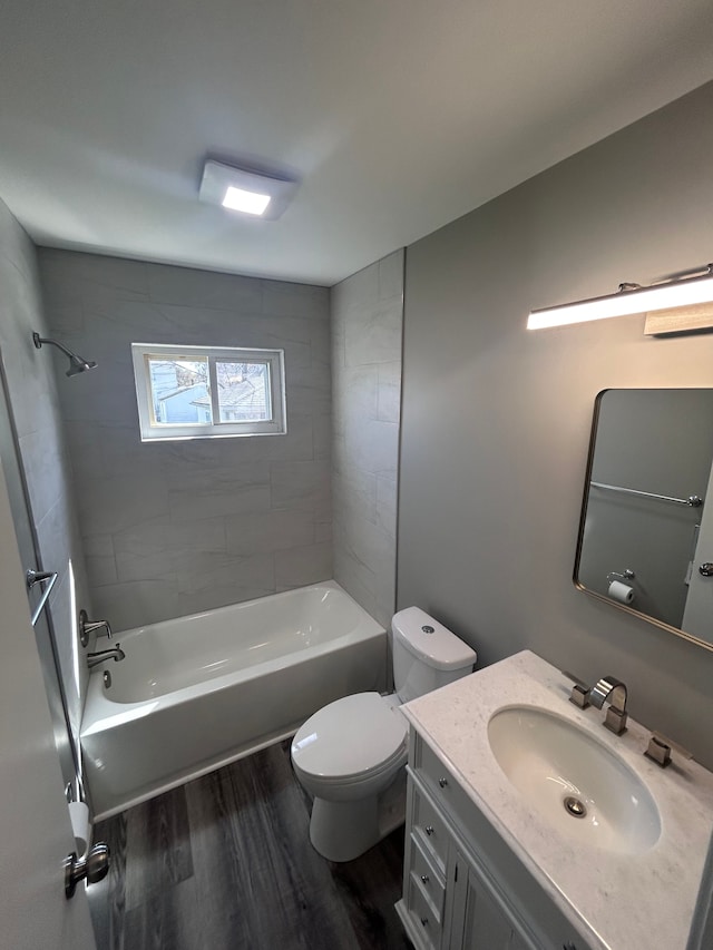 23162 Saxony Ave, Eastpointe, MI 48021 - bathroom with wood finished floors, toilet, vanity, and  shower combination