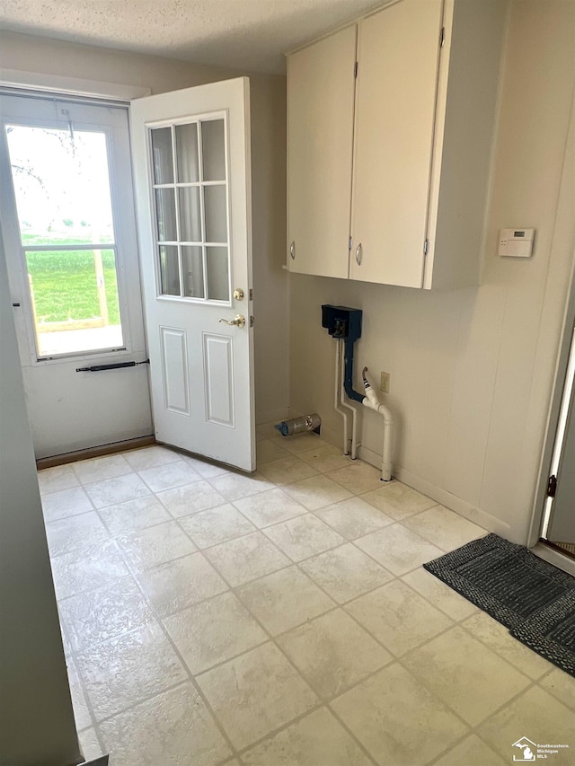 laundry area featuring cabinet space