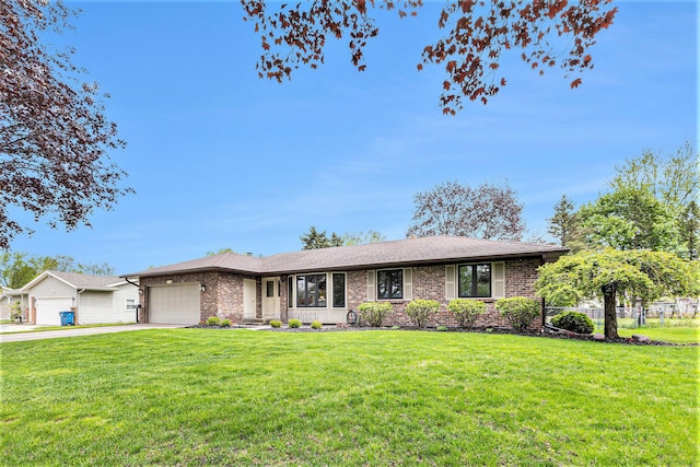 ranch-style home featuring a garage, driveway, brick siding, and a front lawn