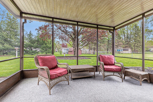 sunroom with view of scattered trees