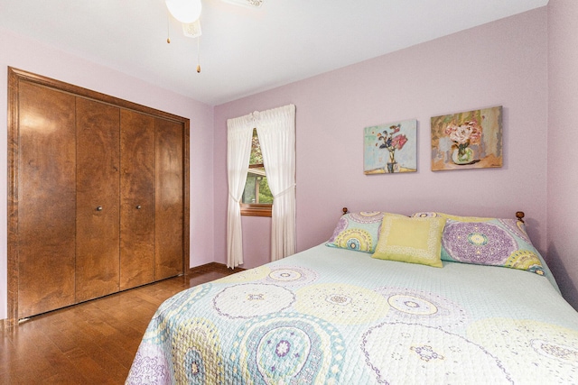 bedroom with wood finished floors and a closet