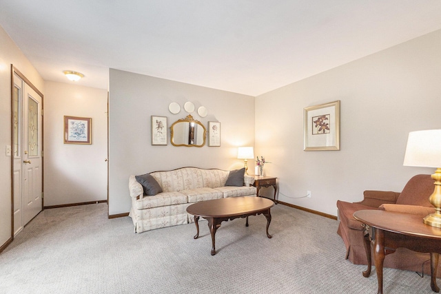 living room with carpet and baseboards