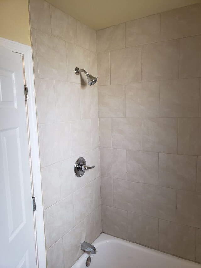 full bath featuring shower / tub combination