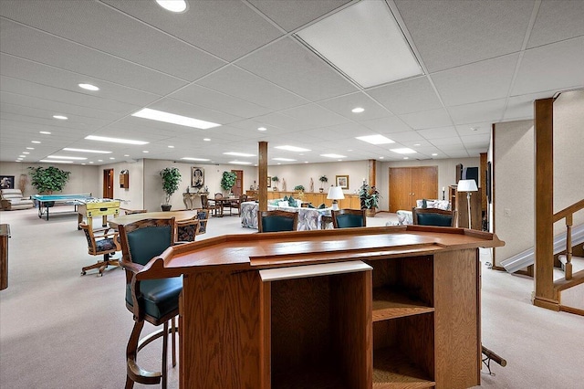 bar area featuring billiards, light carpet, recessed lighting, a paneled ceiling, and stairs