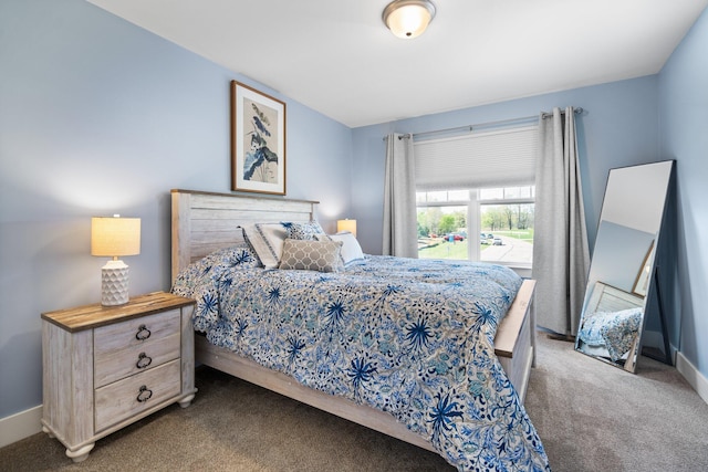 bedroom with carpet flooring and baseboards