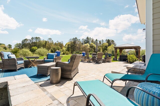 view of patio / terrace with a gazebo and an outdoor hangout area