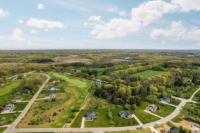 aerial overview of property's location with a heavily wooded area