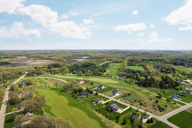 aerial view of property's location with a golf course