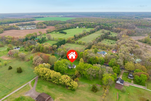 aerial view of property and surrounding area featuring rural landscape