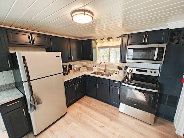kitchen with stainless steel appliances, a sink, light wood-type flooring, wood ceiling, and light stone counters