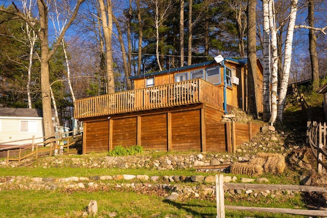 6294 Rock Rd, Lake, MI 48632 - rear view of property featuring a wooden deck and fence