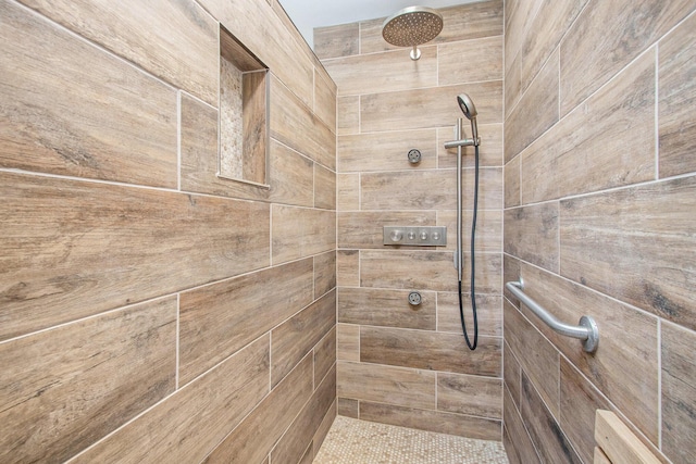 full bathroom with tiled shower