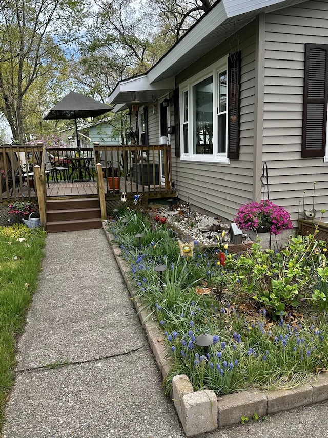 view of home's exterior with a deck