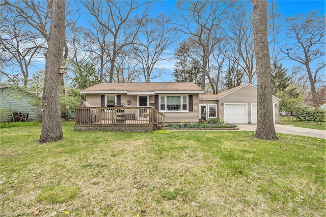 ranch-style home with an attached garage, driveway, a front lawn, and a deck