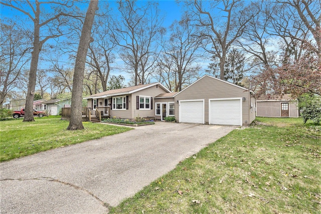 single story home with driveway, an attached garage, and a front lawn