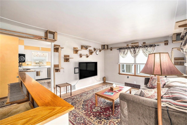 living room featuring light wood-style flooring and baseboards