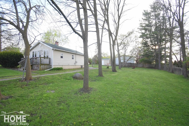 view of yard with a wooden deck