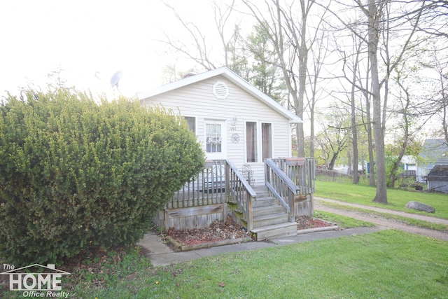 bungalow with a front lawn