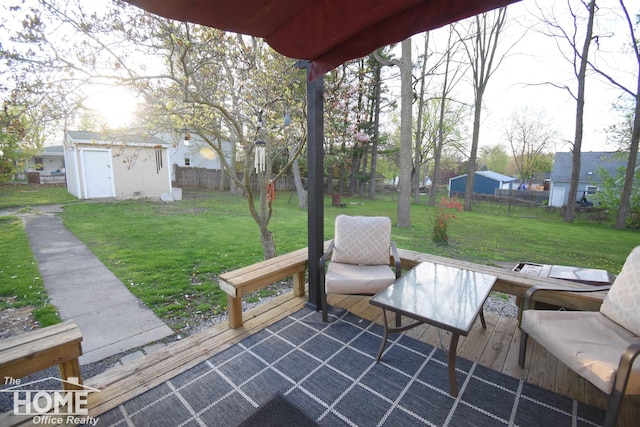 view of patio / terrace with a shed and an outdoor structure