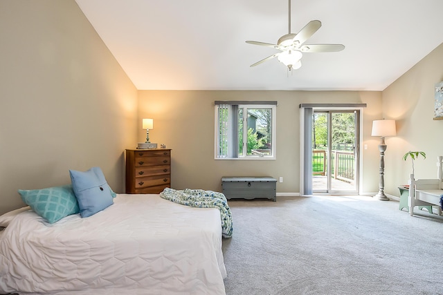 bedroom featuring access to exterior, carpet flooring, lofted ceiling, baseboards, and a ceiling fan