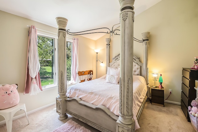 bedroom with carpet flooring and baseboards