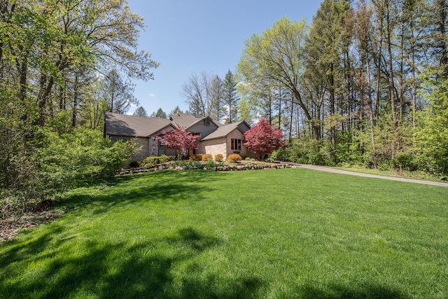 view of front facade with a front lawn and a garage