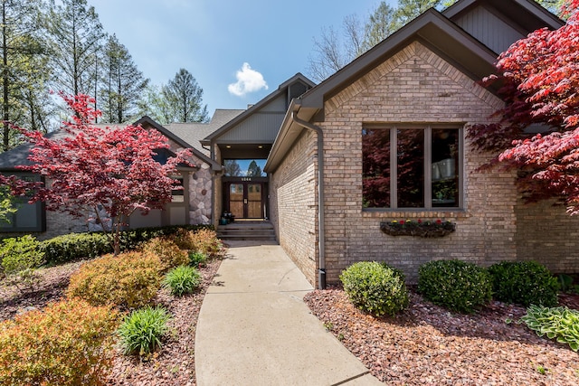 entrance to property with french doors and brick siding