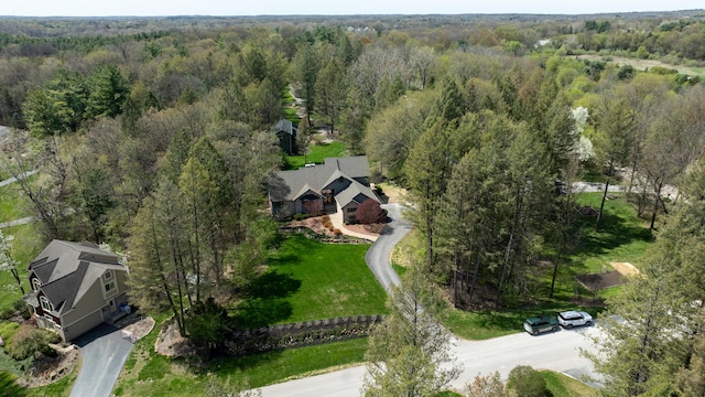 view from above of property with a forest