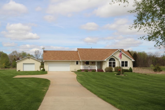 ranch-style house featuring covered porch, a front lawn, driveway, and an attached garage