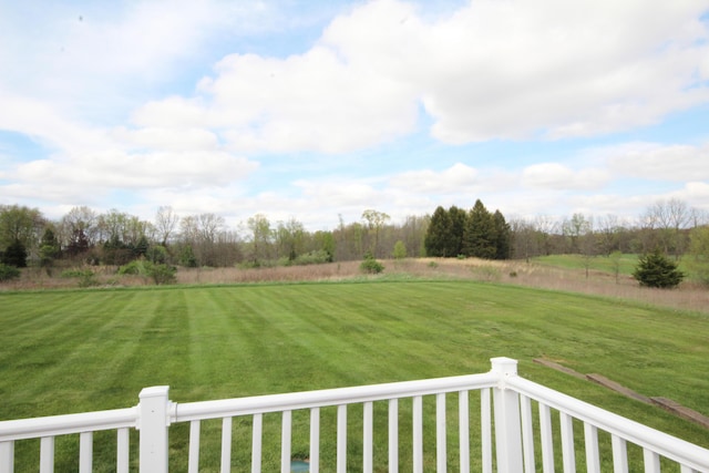 view of green lawn featuring a view of rural / pastoral area