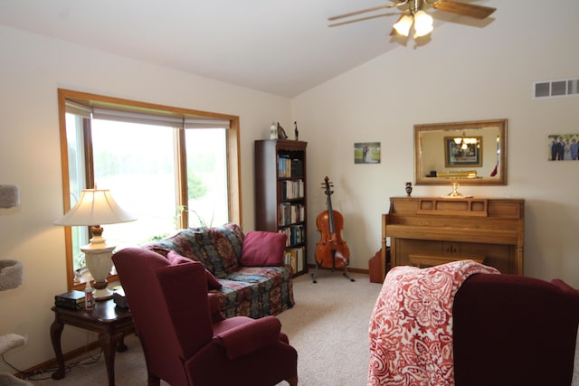 living room with lofted ceiling, carpet flooring, ceiling fan, and baseboards