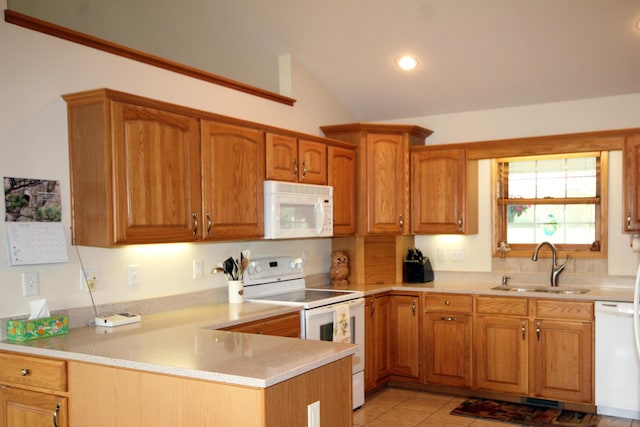 kitchen with white appliances, a sink, light countertops, a peninsula, and vaulted ceiling
