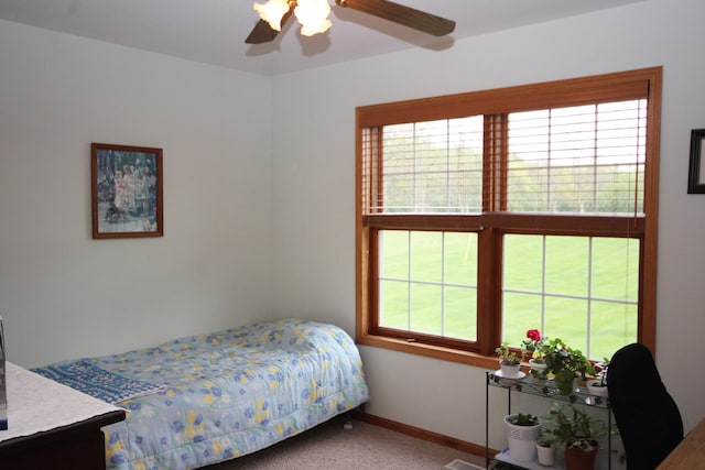 bedroom with carpet, baseboards, and ceiling fan