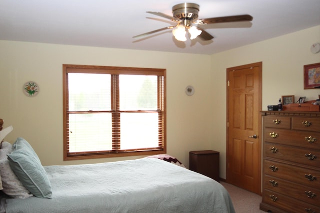 carpeted bedroom featuring a ceiling fan