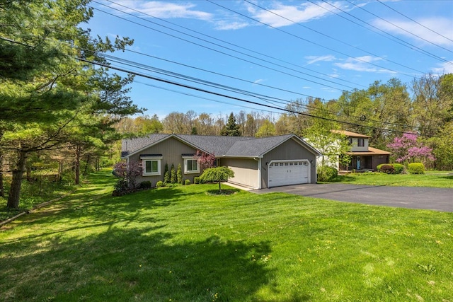 1160 S Baldwin Rd, Lake Orion, MI 48360 - view of front of property with a garage, driveway, and a front yard