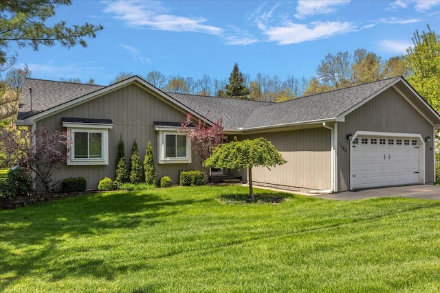 1160 S Baldwin Rd, Lake Orion, MI 48360 - ranch-style house featuring an attached garage, roof with shingles, a front lawn, and asphalt driveway