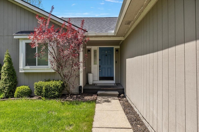 1160 S Baldwin Rd, Lake Orion, MI 48360 - doorway to property with a shingled roof and a lawn