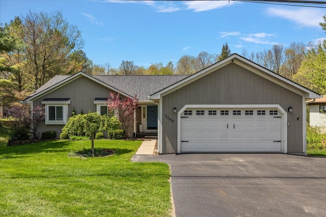 1160 S Baldwin Rd, Lake Orion, MI 48360 - ranch-style home with a front lawn, a garage, asphalt driveway, and a shingled roof