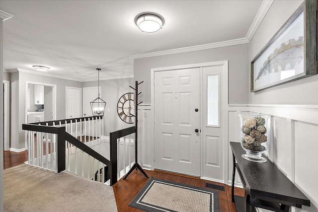 1160 S Baldwin Rd, Lake Orion, MI 48360 - entryway with dark wood finished floors, washer and dryer, and crown molding