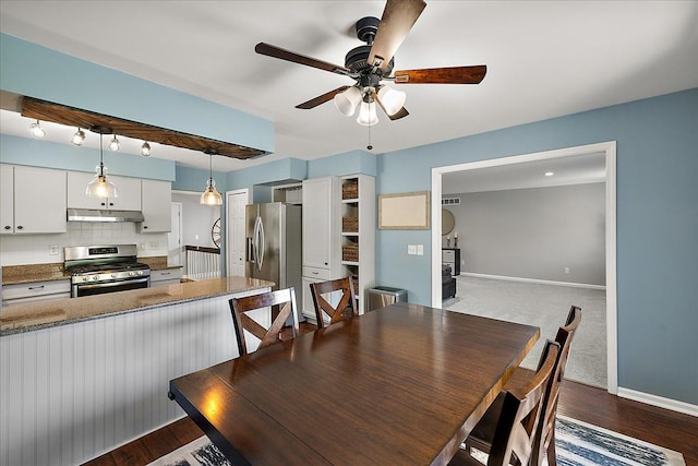 1160 S Baldwin Rd, Lake Orion, MI 48360 - dining space featuring ceiling fan, baseboards, and dark wood finished floors
