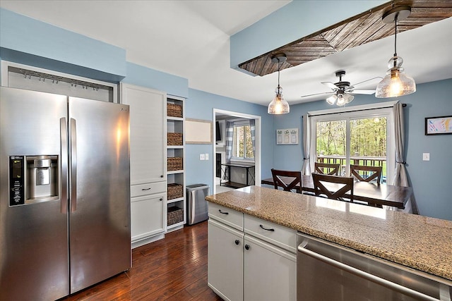 1160 S Baldwin Rd, Lake Orion, MI 48360 - kitchen with stainless steel appliances, white cabinets, dark wood-style flooring, and pendant lighting