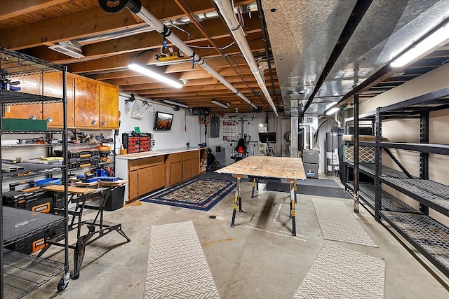 1160 S Baldwin Rd, Lake Orion, MI 48360 - unfinished below grade area with water heater, a workshop area, and electric panel
