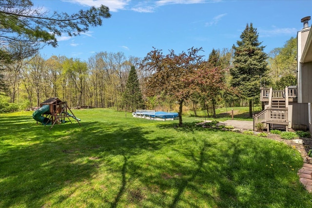 1160 S Baldwin Rd, Lake Orion, MI 48360 - view of green lawn with stairway, a pool, and a deck