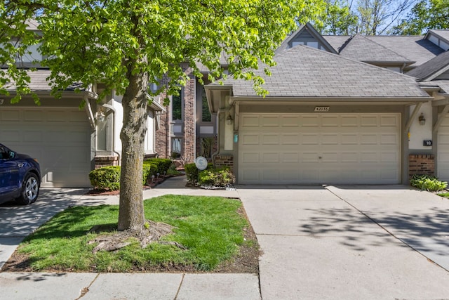 42036 Saratoga Cir, Canton, MI 48187 - townhome / multi-family property with concrete driveway, brick siding, a garage, and a shingled roof