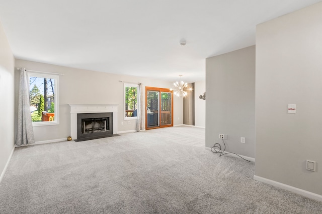 42036 Saratoga Cir, Canton, MI 48187 - unfurnished living room featuring a chandelier, a fireplace with flush hearth, carpet flooring, and baseboards