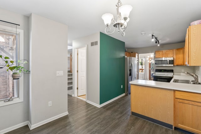 42036 Saratoga Cir, Canton, MI 48187 - kitchen featuring appliances with stainless steel finishes, a sink, dark wood-style flooring, baseboards, and a chandelier