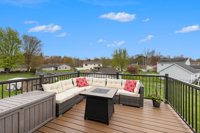 wooden deck with an outdoor living space, a residential view, and a lawn
