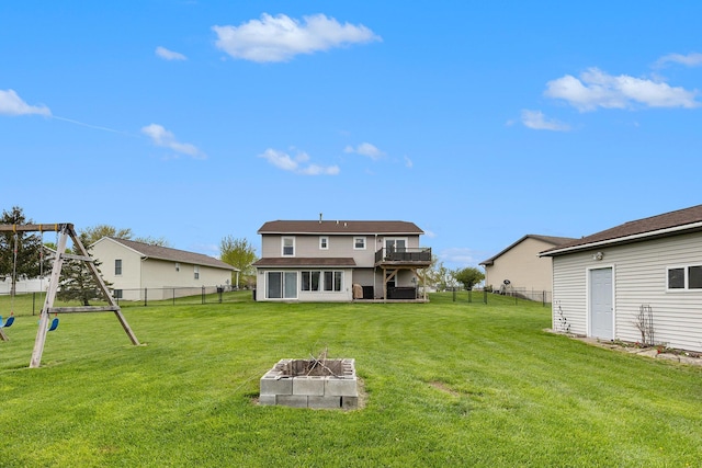 rear view of house with a fire pit