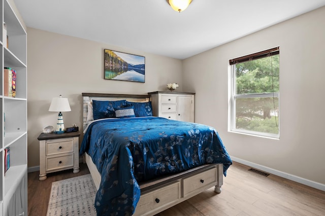 72597 Faye Ct, South Haven, MI 49090 - bedroom featuring wood finished floors and baseboards